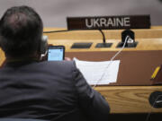 Ukrainian Ambassador to the United Nations Sergiy Kyslytsya uses his smart phone as Russian Foreign Minister Sergey Lavrov speaks during a high level Security Council meeting on the situation in Ukraine, Wednesday, Sept. 20, 2023, at the United Nations headquarters.