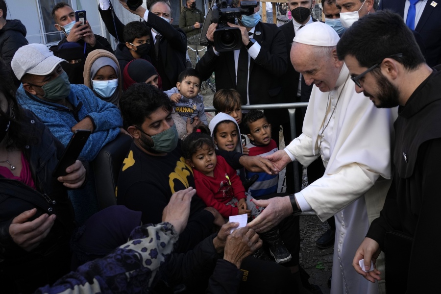 Pope Francis meets migrants during his visit at the Karatepe refugee camp, on the northeastern Aegean island of Lesbos, Greece, Dec. 5, 2021.Ten years after Pope Francis made a landmark visit to the Italian island of Lampedusa to show solidarity with migrants, he is joining Catholic bishops from around the Mediterranean this weekend in France to make the call more united, precisely at the moment that European leaders are again scrambling to stem the tide of would-be refugees setting off from Africa.