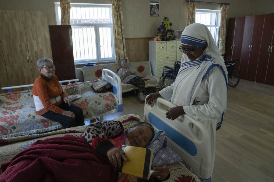 Sister Jeanne Francoise from Rwanda checks on residents at a nursing home run by Missionaries of Charity, a Roman Catholic congregation of women dedicated to the poor founded by Mother Teresa, on the outskirts of Ulaanbaatar, Mongolia on Wednesday, Aug. 30, 2023. Pope Francis is travelling to Mongolia to encourage one of the world's smallest and newest Catholic communities, the first pope to visit the Central Asian country at a time when the Vatican's relations with its two powerful neighbors Russia and China are once again strained.