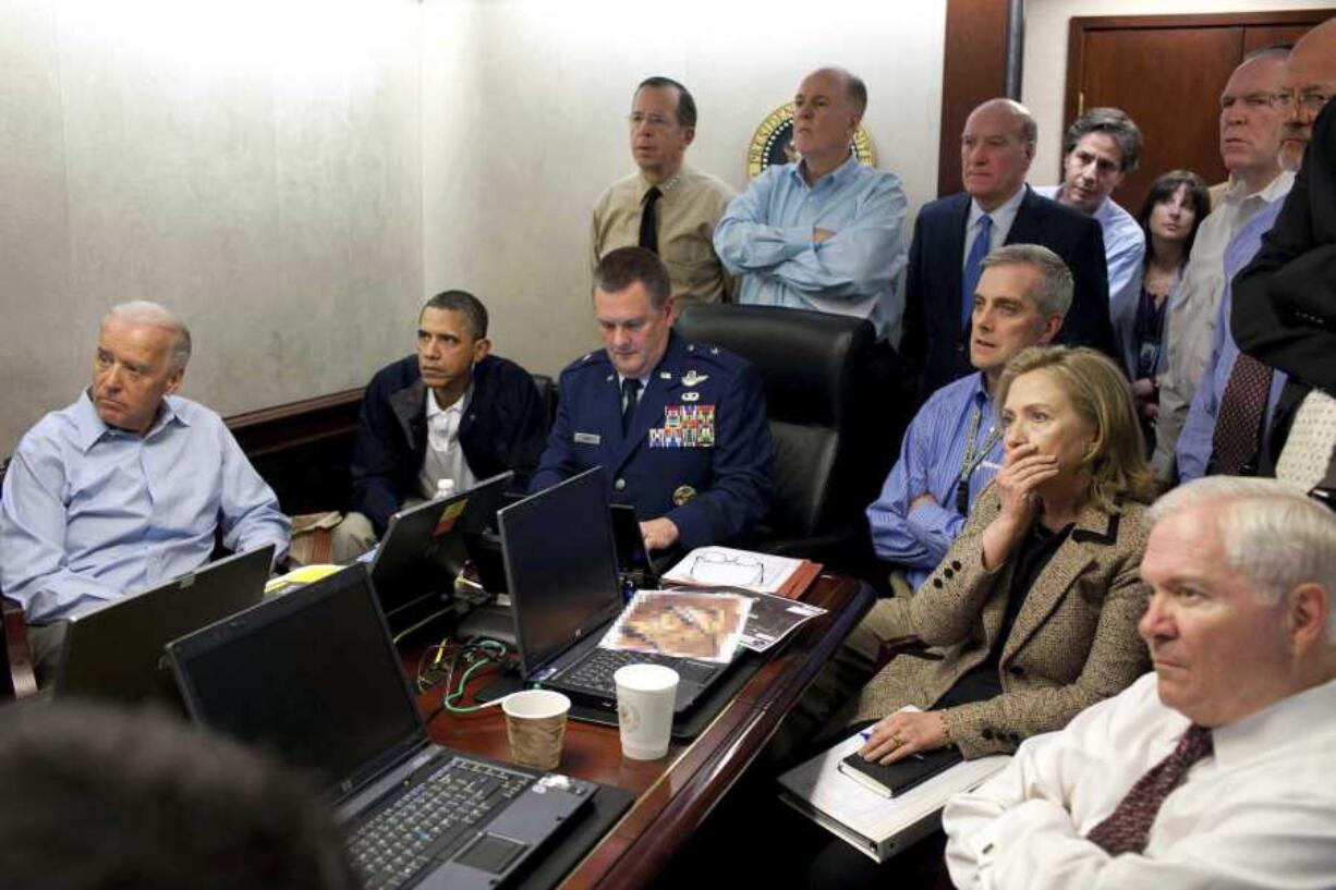FILE - In this May 1, 2011 file image released by the White House and digitally altered by the source to diffuse the paper in front of Secretary of State Hillary Clinton, President Barack Obama and Vice President Joe Biden, along with members of the national security team, receive an update on the mission against Osama bin Laden in the Situation Room of the White House in Washington.