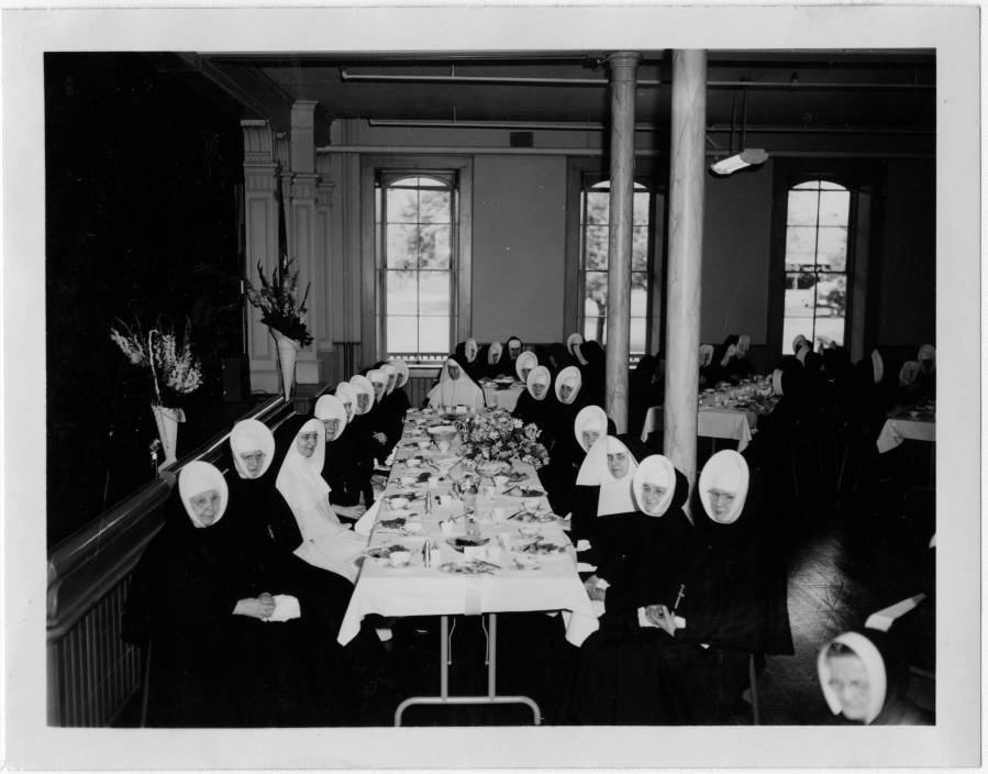 Members of the Sisters of Providence order gather in the Academy's auditorium (today's ballroom) in 1956 to celebrate their centennial. The school and orphanage closed in 1966. The Historic Trust bought the building in 2015.