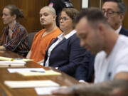Guillermo Raya Leon, second from left, looks on as Gage Brown, right, son of Clark County sheriff's Sgt. Jeremy Brown, speaks to the court during Raya Leon's sentencing at the Clark County Courthouse on Thursday morning, Oct. 5, 2023. Raya Leon was sentenced to life in prison after he was found guilty of aggravated first-degree murder in the 2021 fatal shooting of the sheriff's detective.