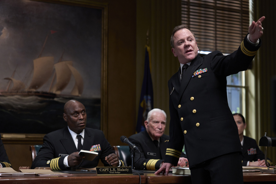 Lance Reddick, left, and Kiefer Sutherland, standing, in the movie "The Caine Mutiny Court-Martial." (Showtime)