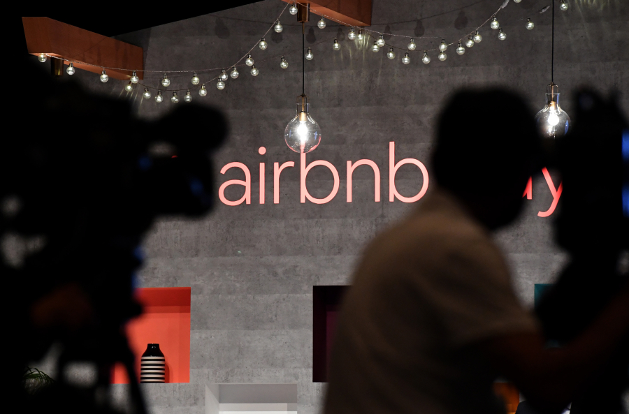 An Airbnb logo is displayed during the company's press conference in Tokyo on June 14, 2018.