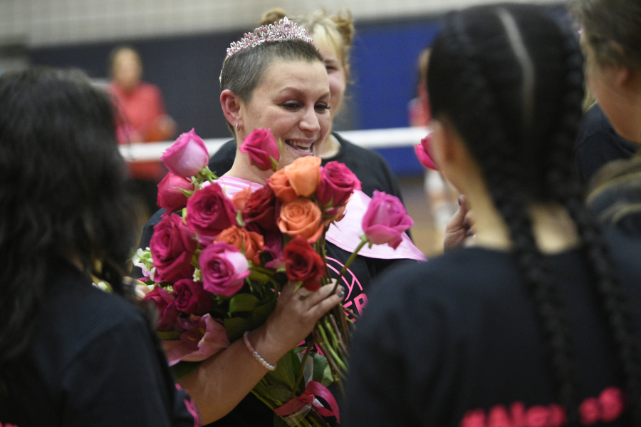 Alexis Mills, mother of La Center volleyball player Kylee Mills, is honored before La Center's Dig Pink match against Castle Rock on Tuesday at La Center High School.