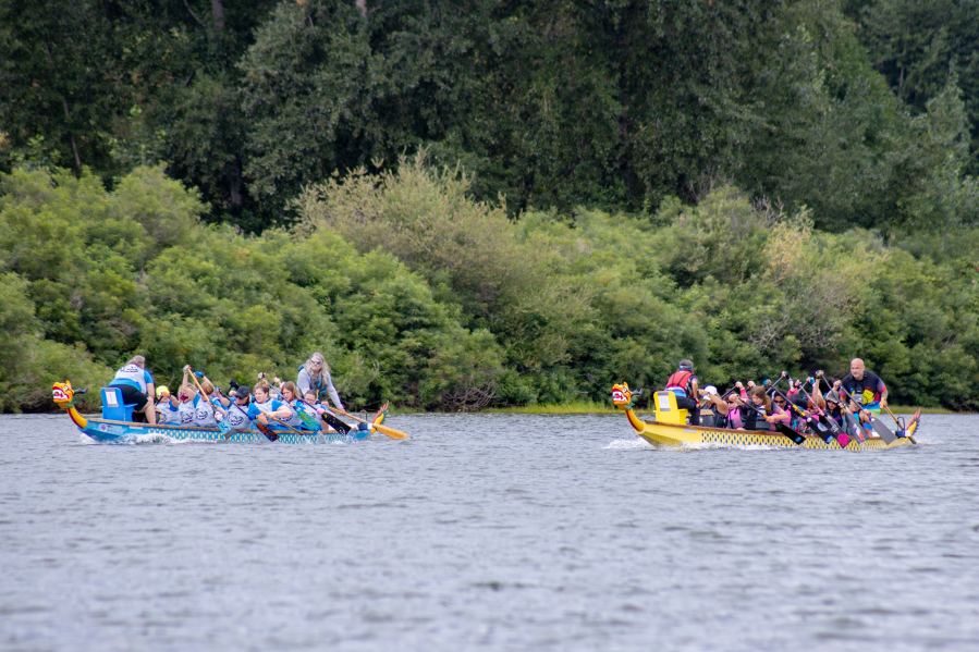 Teams Mighty Women Power and Catch 22 race at a dragon boat competition Aug. 4 in Ridgefield.