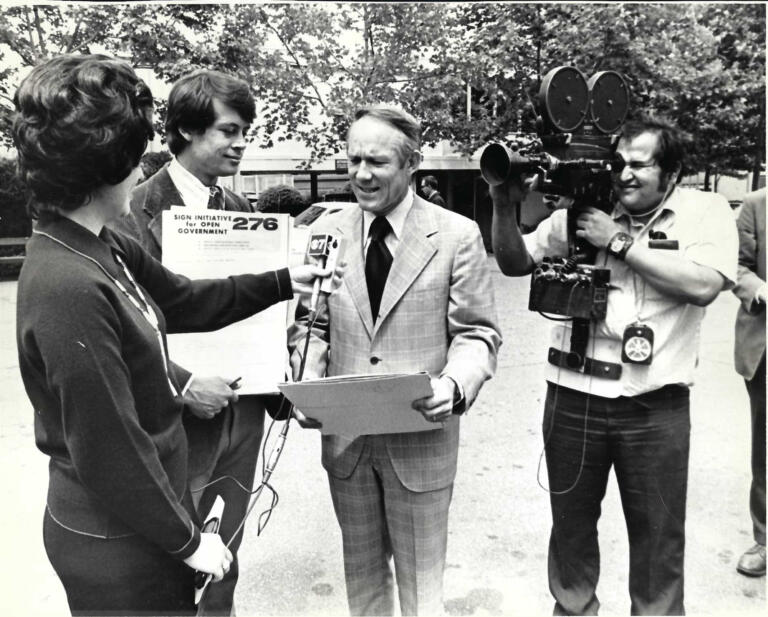 KIRO-TV reporter Tanna (Chattin) Engdahl interviews an official in the early 1970s while the cameras roll.