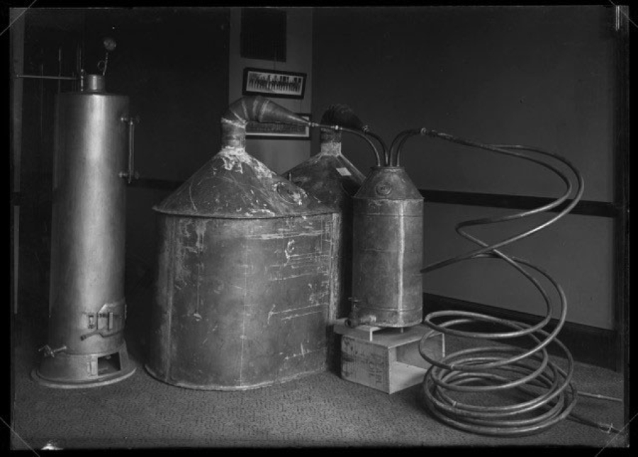 Law officers captured this illegal still in 1925. Rarely were such large stills placed inside buildings. Distilling alcohol poses the hazards of fire and explosion because the process releases flammable compounds. Outlaw distillers in Clark County, like Jesse Cousins, often hid stills on their rural farms.