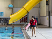 Lifeguard Daniela Valderrana, 19, watches over the pool at Marshall Community Center. A nationwide lifeguard shortage has pushed Vancouver's pools to cut hours and limit their offerings for swim lessons.