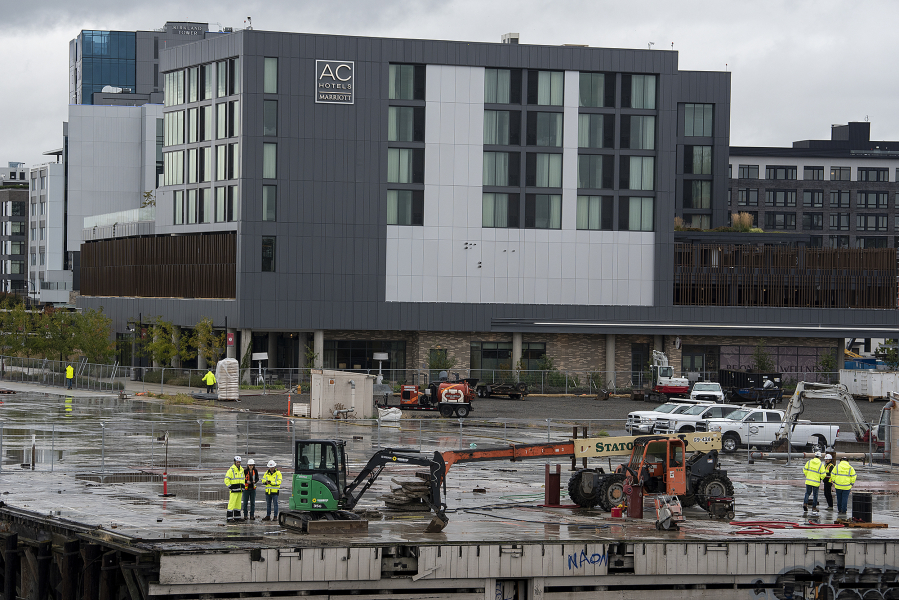 Construction began at the hundred-year-old Terminal 1 dock Tuesday, as work begins to transform it into a public market.