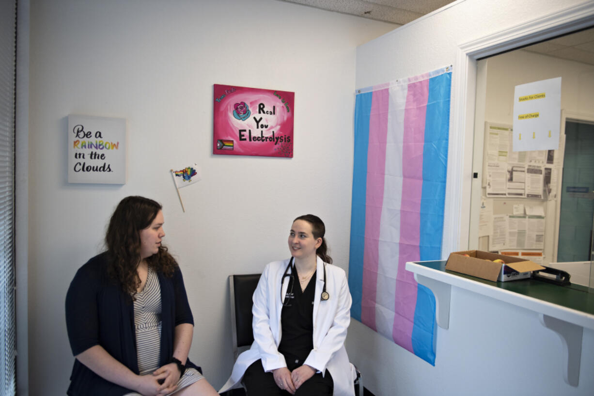 Director Anna Lantry, left, chats with Natalie Paul, nurse practitioner and business owner, at Lavender Spectrum Health. The private practice medical clinic is dedicated to serving the LGBTQ+ and neurodiverse communities.