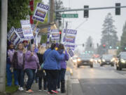 Passing cars on Mill Plain Boulevard honked in support of the health care Kaiser health care workers picketing at Kaiser Permanente's Cascade Park Medical Office Wednesday morning.