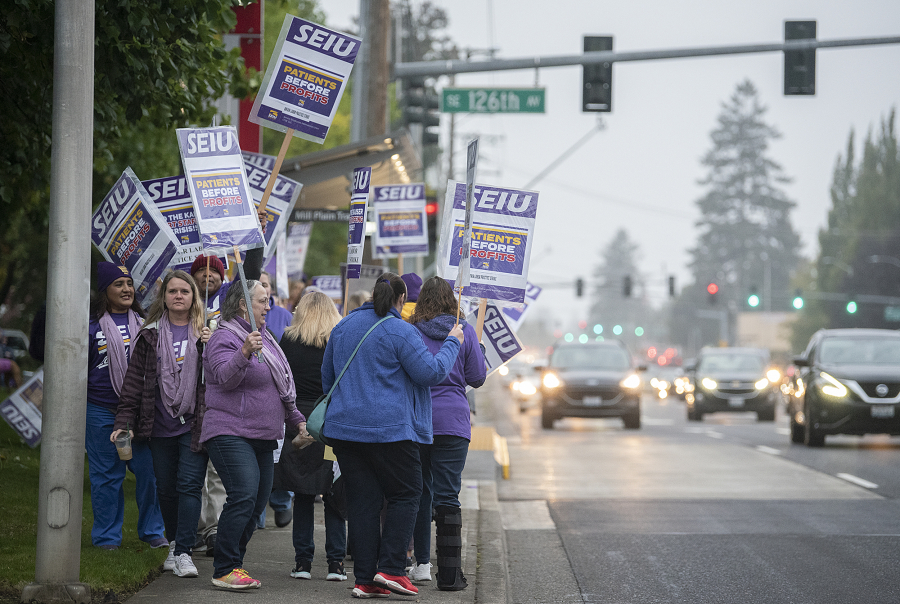 Passing cars on Mill Plain Boulevard honked in support of the health care Kaiser health care workers picketing at Kaiser Permanente's Cascade Park Medical Office Wednesday morning.