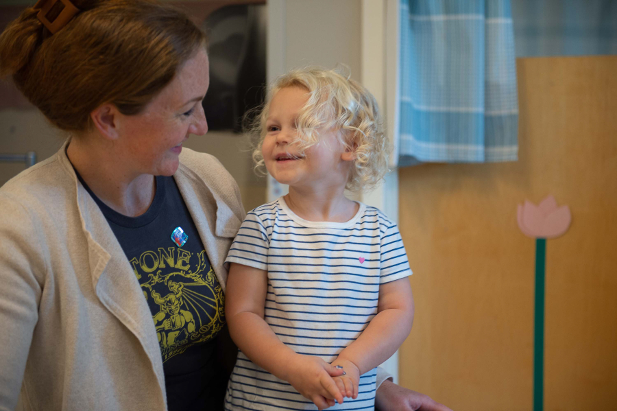Nora Larson, 2 1/2 , shares a moment with her mother Katie Larson before starting her day Wednesday morning at Washington State University Vancouver's on-campus child care facility. This week is the first week of on-campus child care at WSU Vancouver since the program was halted and reevaluated after COVID-19 restrictions.