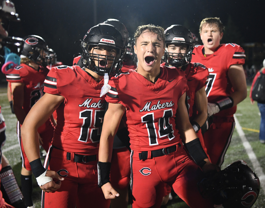 Camas players Alex Hroza, left, and Beau Harlan celebrate after 21-9 win against Skyview on Friday.