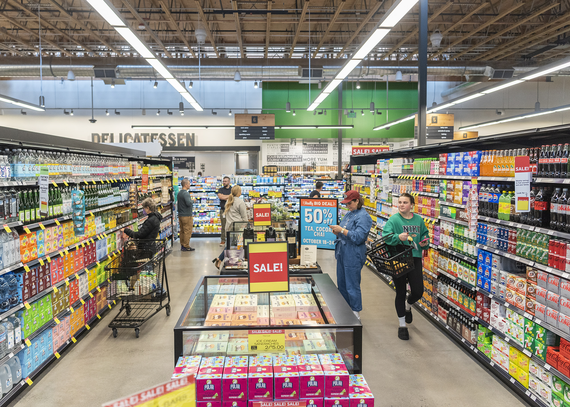 Shoppers browse the shelves Wednesday at the grand opening of the downtown New Seasons.