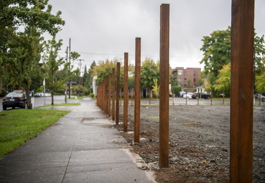 Fence posts stand in the ground Monday at the site of Vancouver's third Safe Stay community on West 11th Street.