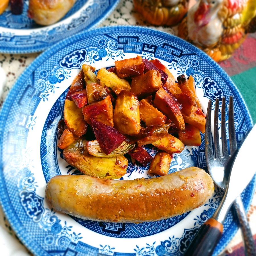 Roasting vegetables intensifies their flavors and caramelizes their natural sugars. Pair veggies with British-style sausage and you've got a meal.