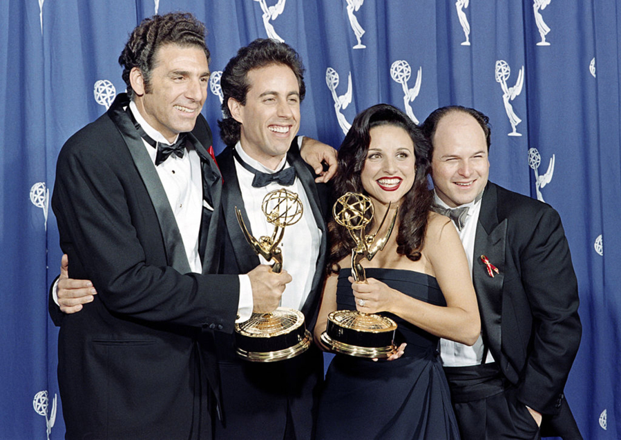 From left, Michael Richards, Jerry Seinfeld, Julia Louis-Dreyfus and Jason Alexander of "Seinfeld" show pose with their Emmys for outstanding comedy series on Sept. 19, 1993, in Pasadena, California.