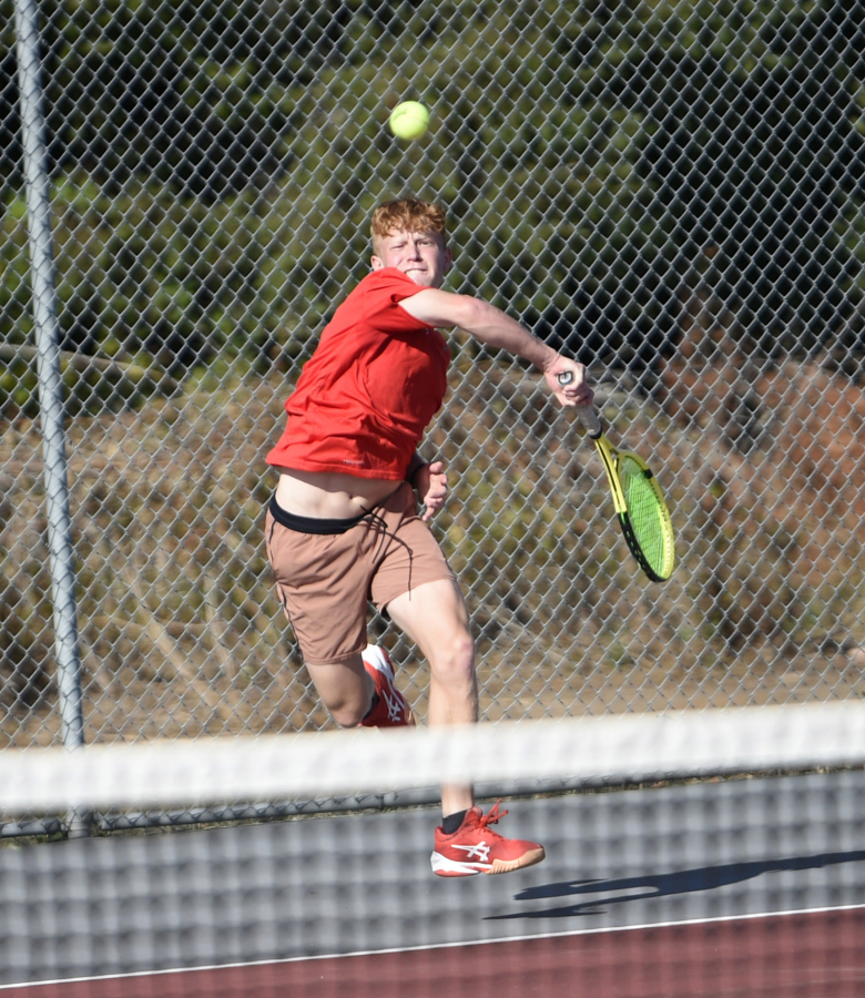 Tommy James of Camas hits a shot in a singles match against Aiden Bucerzan of Skyview at Camas High School on Monday, Sept. 18, 2023.
