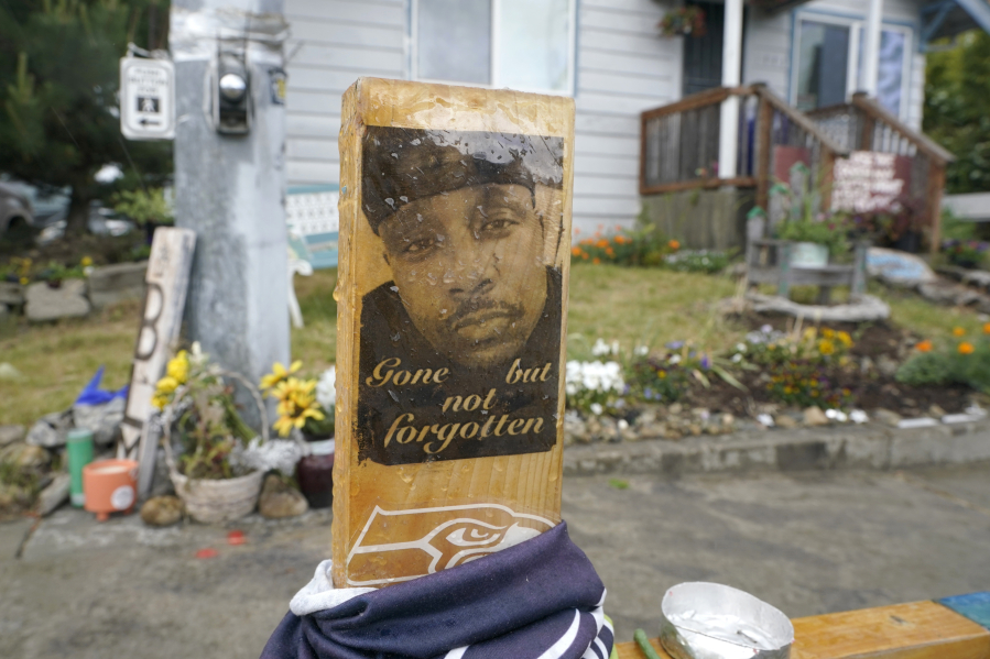A sign is displayed on May 27, 2021, at a memorial in Tacoma where Manuel Ellis died on March 3, 2020, after he was restrained by police officers.