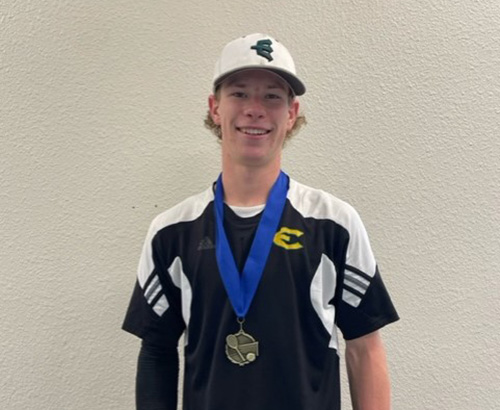 Will Goth of Evergreen poses for a photo after winning the singles title at the 3A district tournament
