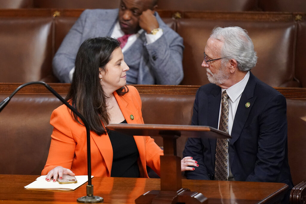 Rep. Elise Stefanik, R-N.Y., talks with Rep. Dan Newhouse, R-Wash., in the House chamber as the House meets for a second day to elect a speaker and convene the 118th Congress in Washington, Wednesday, Jan. 4, 2023.