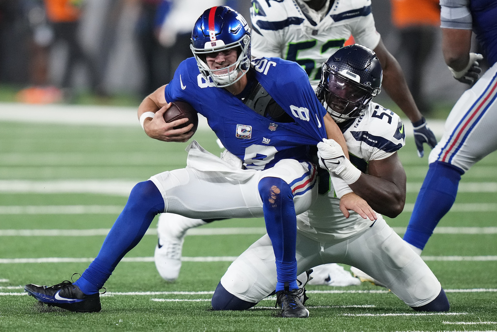 New York Giants quarterback Daniel Jones (8) is sacked by Seattle Seahawks linebacker Boye Mafe (53) during the fourth quarter of an NFL football game, Monday, Oct. 2, 2023, in East Rutherford, N.J.
