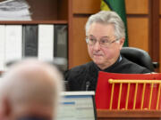 Judge Bryan Chushcoff presides as the state delivers opening remarks during the trial of Tacoma Police Officers Christopher Burbank, Matthew Collins and Timothy Rankine in the killing of Manny Ellis, Tuesday, Oct. 3, 2023, at Pierce County Superior Court, Tacoma, Wash.