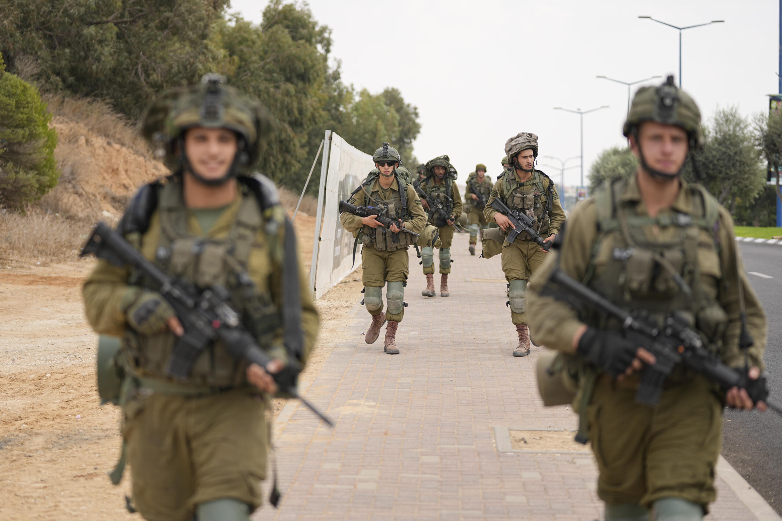 Israeli soldiers arrive at Sderot, a town close to the Gaza Strip, Wednesday, Oct.11, 2023.