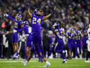 Washington safety Makell Esteen (24) reacts to a turnover on downs by Arizona State with less than a minute left in the game during the second half of an NCAA college football game Saturday, Oct. 21, 2023, in Seattle. Washington won 15-7.