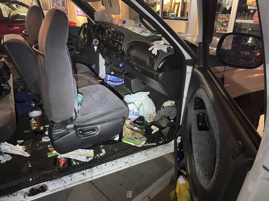 This photo provided by the Anderson Police Department shows the inside of a pick-up driven by a womsn who had abducted her children in Arkansas. The photo was taken in Saturday, Oct. 21, 2023 in Anderson, Calif. Authorities say they rescued eight children after they had allegedly been abducted by their biological mother from their foster homes in Arkansas. (Anderson Police Dept.