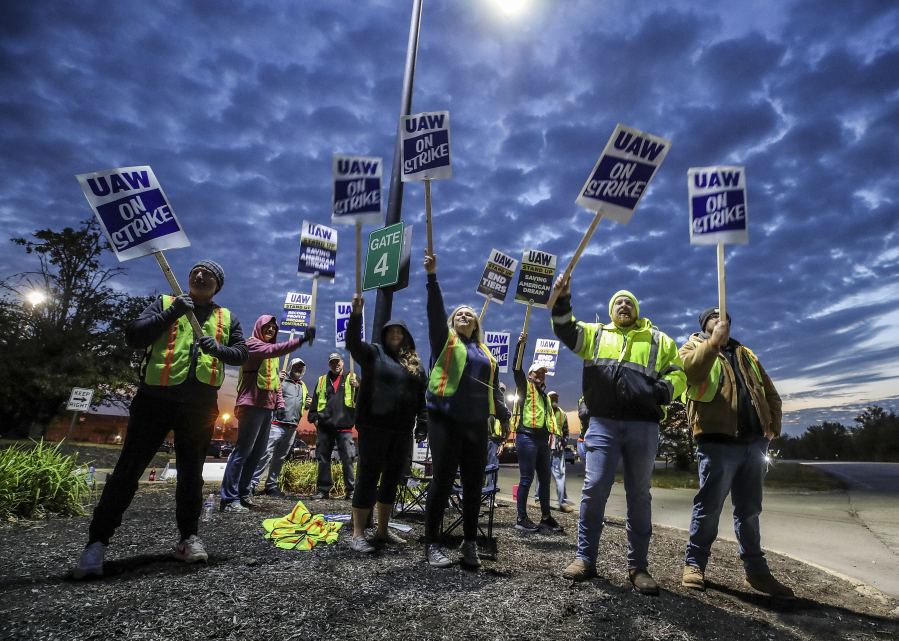 UAW local 862 members strike outside of Ford's Kentucky Truck Plant in Louisville, Ky. on Thursday, Oct. 12, 2023. The United Auto Workers union significantly escalated its walkout against Detroit's Three automakers, shutting down Ford's largest factory and threatening Jeep maker Stellantis.