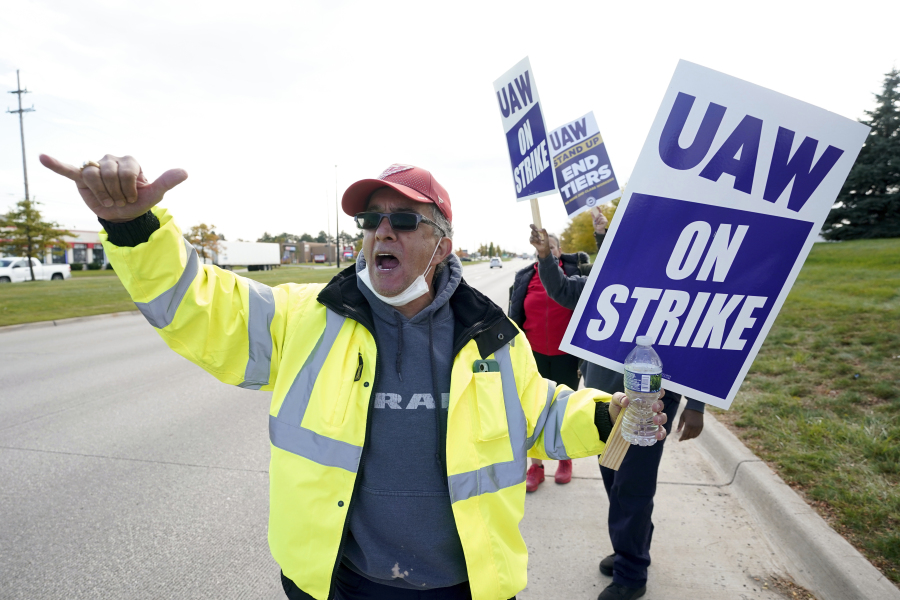 George Raad, a United Auto Worker member, walks the picket line during a strike at the Stellantis Sterling Heights Assembly Plant, in Sterling Heights, Mich., Monday, Oct. 23, 2023.