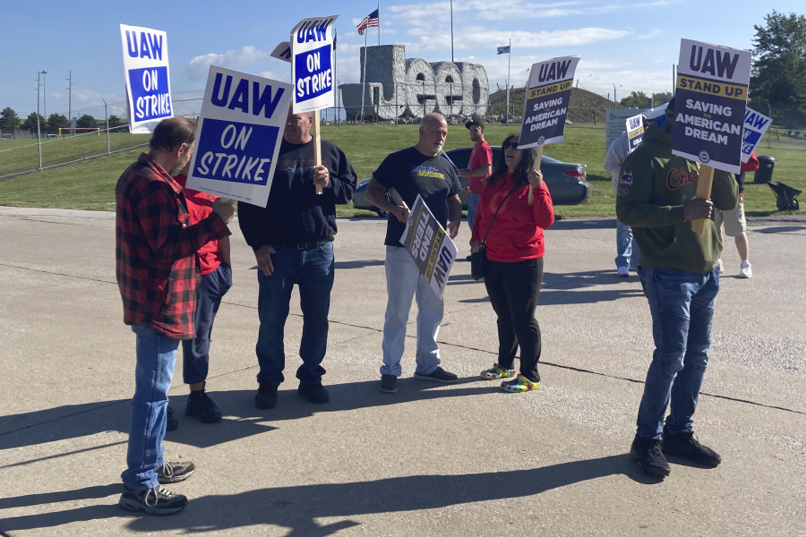 Striking United Auto Workers picket outside the Stellantis plant that makes Jeeps in Toledo, Ohio, on Friday, September 15, 2023. The UAW is seeking a contract that will end a big disparity in pay for temporary workers.