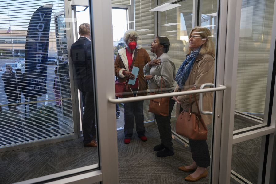 FILE - Voters line up at the door before the start of early in-person voting at the Hamilton County Board of Elections in Cincinnati, Wednesday, Oct. 11, 2023.
