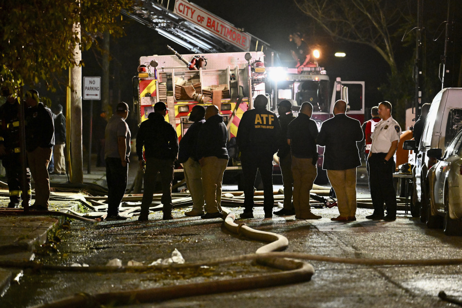 First responders work the scene after a deadly fire on Thursday, Oct. 19, 2023, in Baltimore.