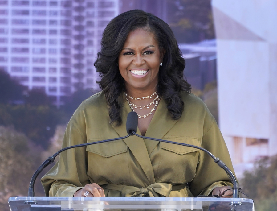 FILE - Former first lady Michelle Obamad smiles as she speaks during a groundbreaking ceremony for the Obama Presidential Center in Chicago on Sept. 28, 2021. Obama will narrate a new digital audio edition of Maurice Sendak's children's book ""Where the Wild Things Are." HarperCollins Publishers announced Tuesday that the audio download will go on sale Oct. 31, the 60th anniversary of the book's original release.