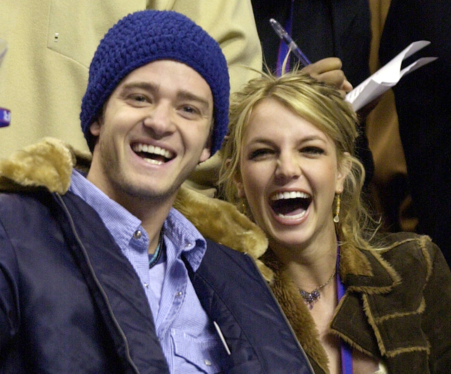 FILE - Justin Timberlake and Britney Spears appear at the 2002 NBA All-Star game in Philadelphia on Feb. 10, 2002. Spears' memoir "The Woman in Me" releases Oct. 24.