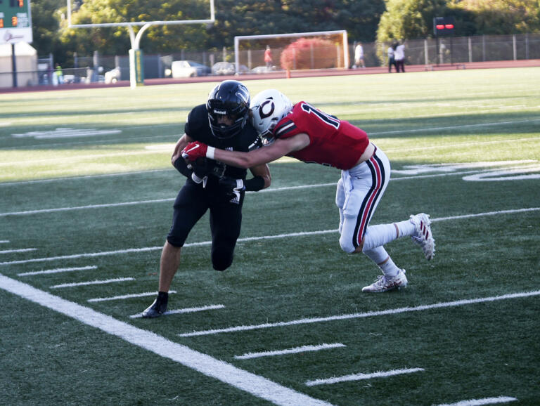 Camas’ Trenton Swanson (right) delivers a hit on Union’s Chase Lofton in Camas’ 52-27 win over Union at McKenzie Stadium on Friday, Oct. 20, 2023.
