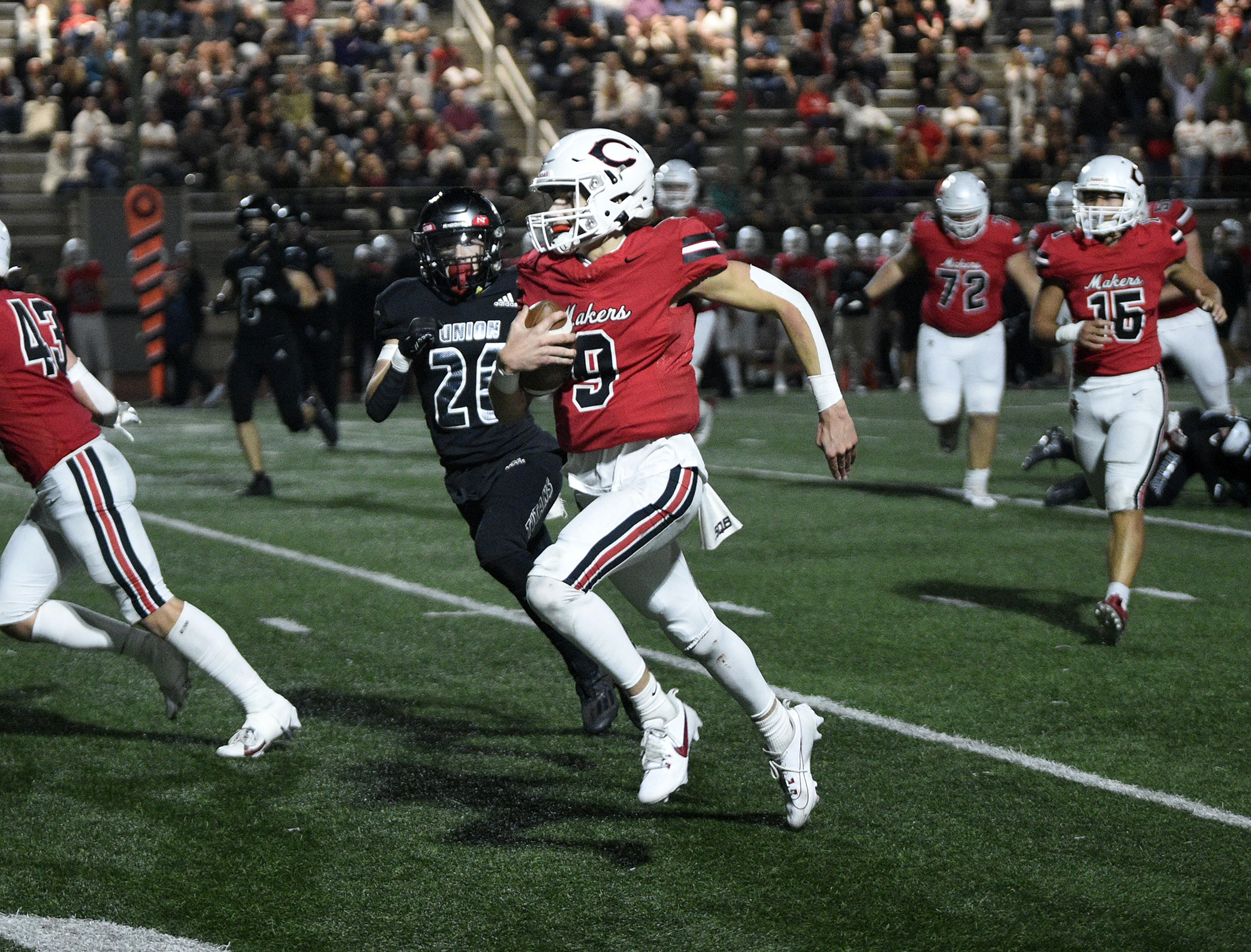Camas quarterback Jake Davidson runs downfield in the Papermakers’ 52-27 win over Union at McKenzie Stadium on Friday, Oct. 20, 2023.