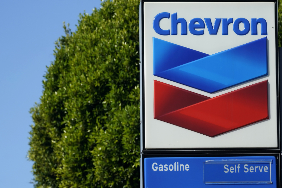 A Chevron logo is shown at a gas station in San Francisco, Monday, Oct. 23, 2023. Chevron is buying Hess Corp. for $53 billion as major producers seize the initiative while oil prices surge.