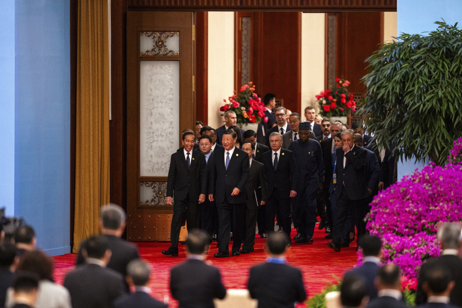 Chinese President Xi Jinping, third form left, chats with Indonesian President Joko Widodo, left, as they and other foreign leaders arrive at the opening ceremony of the Belt and Road Forum at the Great Hall of the People in Beijing, Wednesday, Oct. 18, 2023.