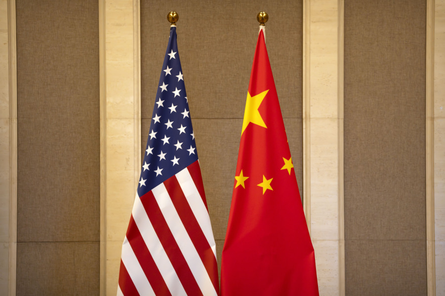 FILE - United States and Chinese flags are set up before a meeting between Treasury Secretary Janet Yellen and Chinese Vice Premier He Lifeng at the Diaoyutai State Guesthouse in Beijing, on July 8, 2023. China said the United States is the "biggest disruptor of regional peace and stability" in the world in a scathing response Wednesday, Oct. 25, 2023 to a Pentagon report on China's growing military buildup.