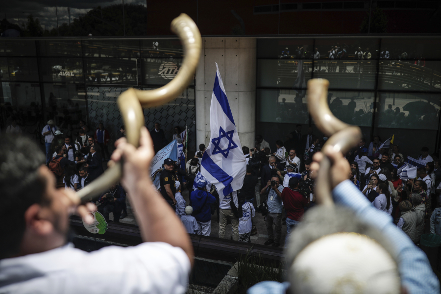 People gather to show support for Israel and protest the war outside the Israeli embassy in Bogota, Colombia, Monday, Oct. 9, 2023, two days after Hamas fighters launched a deadly, surprise attack on Israel.