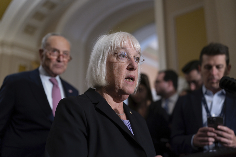 Senate Appropriations Committee Chair Patty Murray, D-Wash., joined at rear by Senate Majority Leader Chuck Schumer, D-N.Y., left, speaks to reporters following a closed-door caucus meeting, at the Capitol in Washington, Wednesday, Sept. 27, 2023. (AP Photo/J.