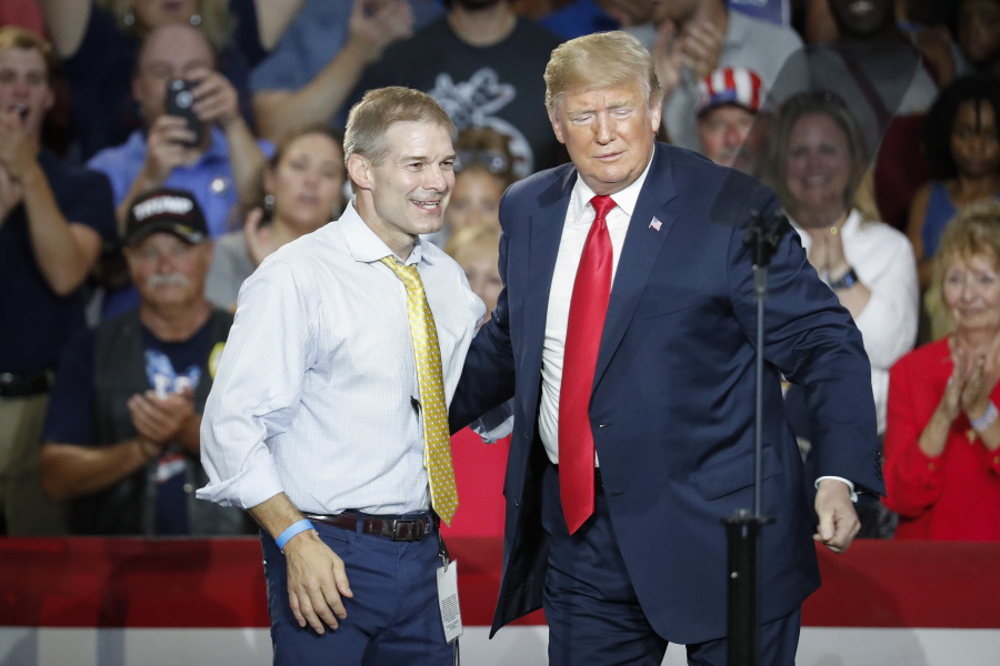 FILE - Then-President Donald Trump, right, encourages Rep. Jim Jordan, R-Ohio, left, to speak during a rally, Saturday, Aug. 4, 2018, in Lewis Center, Ohio.