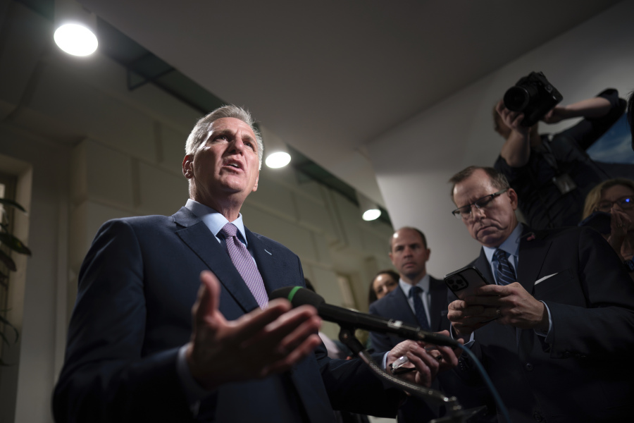 Speaker of the House Kevin McCarthy, R-Calif., talks to reporters after a closed-door meeting with Rep. Matt Gaetz, R-Fla., and other House Republicans after Gaetz filed a motion to oust McCarthy from his leadership role, at the Capitol in Washington, Tuesday, Oct. 3, 2023. (AP Photo/J.