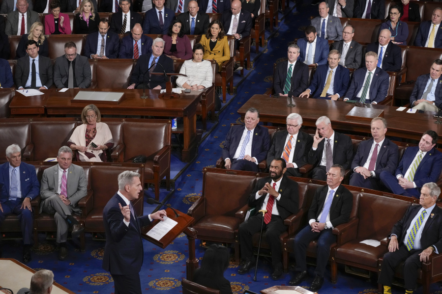 Former Speaker Kevin McCarthy, R-Calif., who was ousted by the hardline conservatives in his own party earlier this month, bottom left, praises Rep. Jim Jordan, R-Ohio, third row third from right, at the start of a third ballot in his bid to become speaker of the House, at the Capitol in Washington, Friday, Oct. 20, 2023. (AP Photo/J.