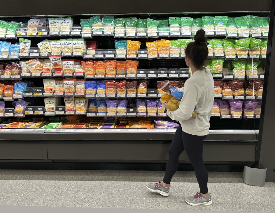 A shopper peruses cheese offerings at a Target store Wednesday, Oct. 4, 2023, in Sheridan, Colo. On Thursday, the Labor Department issues its report on inflation at the consumer level.